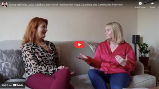 Two women seated on a sofa engaged in conversation, one gesturing with her hands. A YouTube video interface overlays the image.